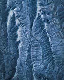 An overhead view of the blue textured mountain ranges. - free wallpaper image