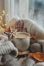 A cup of steaming coffee, with gingerbread cookies, a warm sweater and sparkly gold star decorations, creating a cozy Christmas atmosphere. - wallpaper image