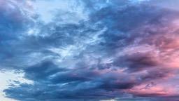 The sky is filled with blue and purple clouds, some of which have a pale pink hue, creating a dreamy color scheme. - free wallpaper image