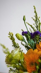 A bouquet of flowers, including yellow, orange and purple flowers. - free wallpaper image